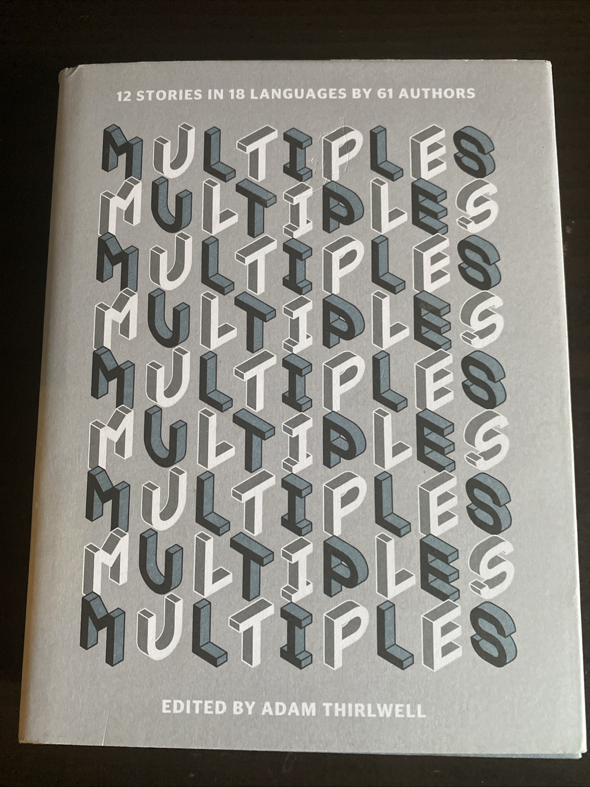 Multiples: 12 Stories in 18 Languages by 61 Authors by Thirlwell, Adam Hardback
