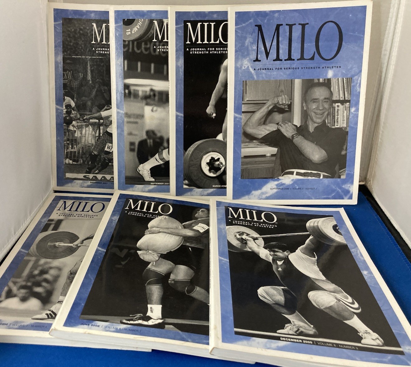 WEIGHTLIFTING-MILO JOURNALS FOR SERIOUS STRENGTH ATHLETES. LOT OF 7. 2000-2001