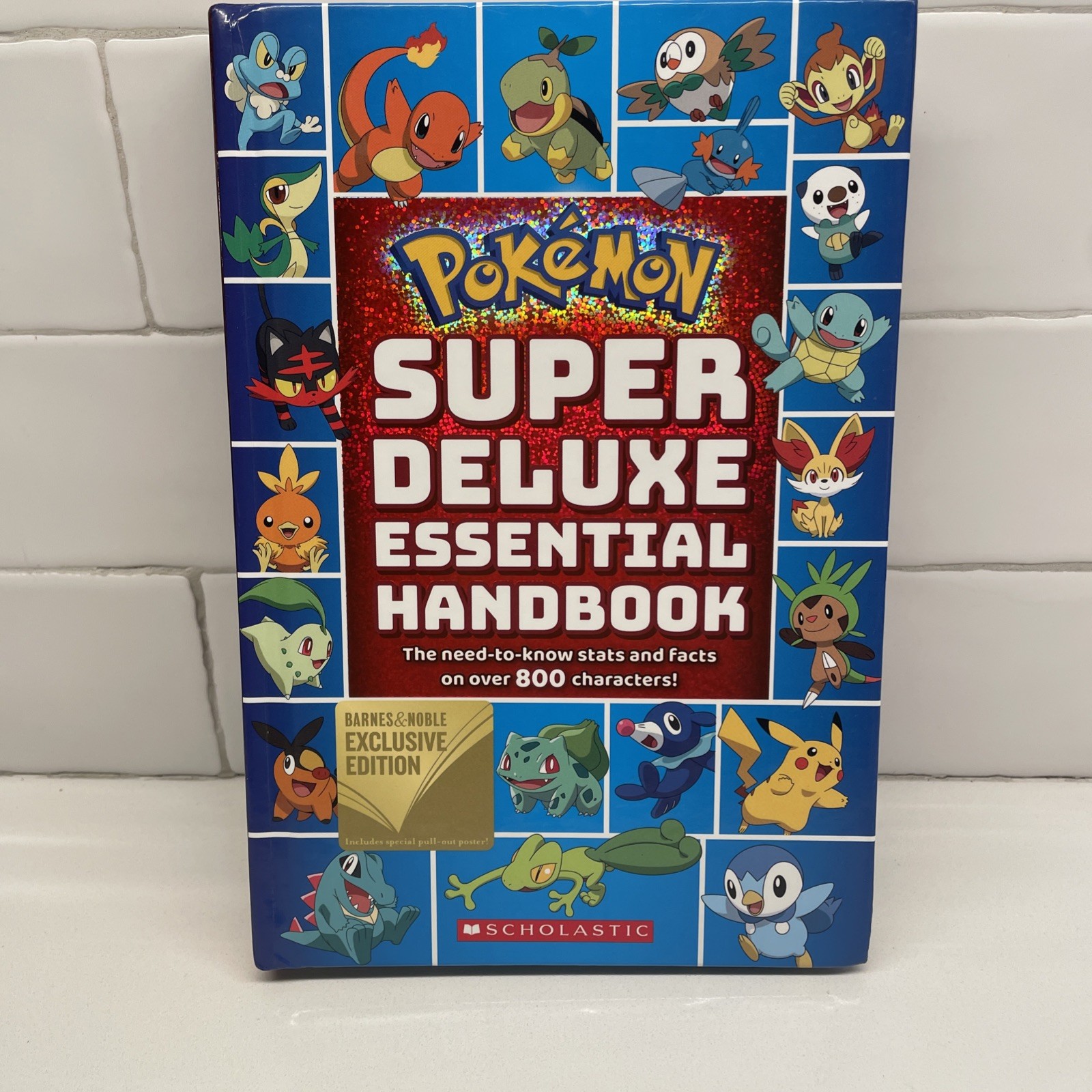Pokemon Super Deluxe Essential Handbook by Scholastic, Hardcover