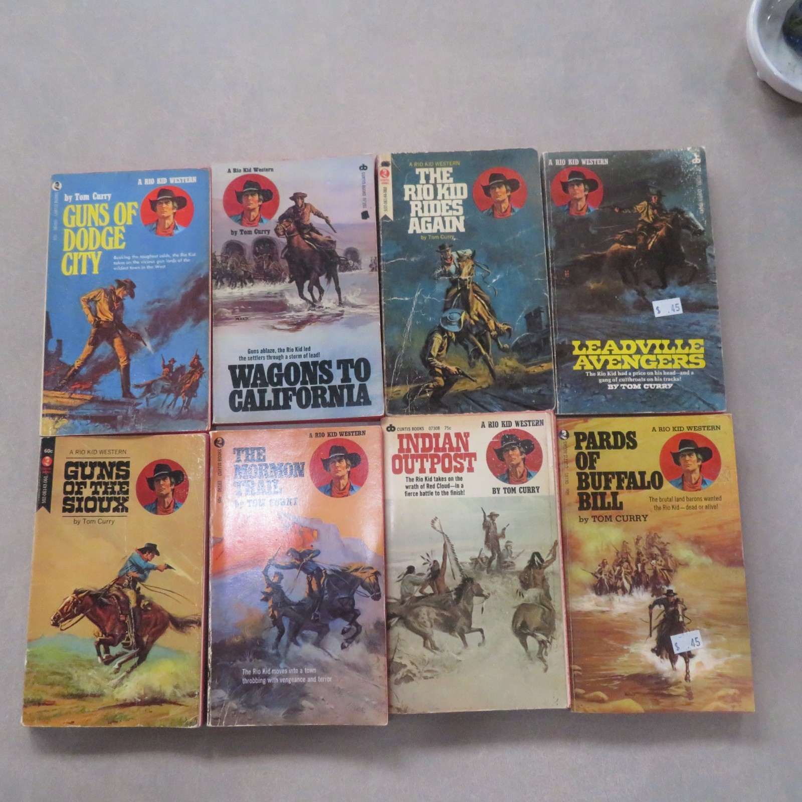 (Lot 285) 8 Western Titles by Tom Curry, vintage
