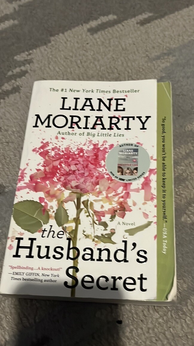 The Husbands Secret- book by Liane Moriarty. Paper back fiction book 445 pages.